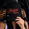 Raisin hell embroidered Trucker Hat by Madness & Mayhem LLC