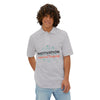 Motivation Is a Universal Language Polo — Tristan's Treehouse Men's Piqué by Tristan’s Treehouse