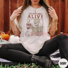 "Staying Alive" Coffee T-Shirt – Funny Skeleton Tee, Trendy Retro Halloween, Women's Comfort Colors Shirt by Dog Mom Hat