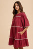 Tassel Contrast Trim Tie Neck Half Sleeve Tiered Dress – Bohemian-Inspired Dress with Tassel Details, Adjustable Tie Neck, and Tiered Design for a Flowing, Feminine Silhouette by Stevvex