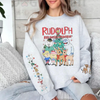 Nostalgic Rudolph Reindeer Crewneck – Unisex Christmas Jumper with Unique Sleeve Graphic by Dog Mom Hat