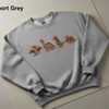Embroidered Gingerbread Dinosaur Christmas Sweatshirt by Dog Mom Hat