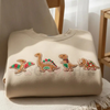 Embroidered Gingerbread Dinosaur Christmas Sweatshirt by Dog Mom Hat
