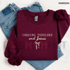 "Chasing Jesus and Toddlers" Coquette Sweatshirt by Dog Mom Hat
