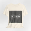 Gratitude is a Universal Language – T-Shirt by Tristan’s Treehouse