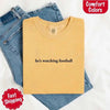He’s Watching Football Tee - Comfort Colors Funny Shirt for Her by Adorb Custom Tees