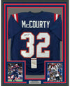 Framed Autographed/Signed Devin McCourty 35x39 New England Blue Football Jersey JSA COA