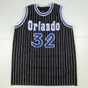 Autographed/Signed Shaquille Shaq O'Neal Orlando Black Pinstripe Basketball Jersey Beckett BAS COA