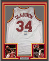 Framed Autographed/Signed Hakeem Olajuwon 35x39 Houston White Basketball Jersey Beckett BAS COA