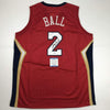 Autographed/Signed Lonzo Ball New Orleans Red Basketball Jersey Beckett BAS COA