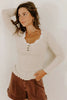 Black Lace Neckline Button Decor Lettuce Edge Long Sleeve Ribbed Top by Wild and Free Boutique