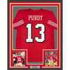Framed Autographed/Signed Brock Purdy 35x39 San Francisco Red Alternate Football Jersey Beckett BAS COA