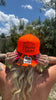 Hotter Than A Hoochie Coochie Trucker Hat by Luckless Outfitters