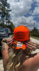 Hotter Than A Hoochie Coochie Trucker Hat by Luckless Outfitters