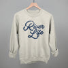 River Life (Distressed Script) by Ivy + Cloth