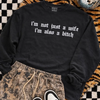 Not just a wife embroidered sweatshirt by Madness & Mayhem LLC