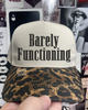 Barely functioning Leopard embroidered hat by Madness & Mayhem LLC
