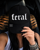Feral embroidered Trucker Hat by Madness & Mayhem LLC