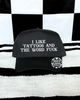 Tattoos & the word fuck embroidered Black Hat by Madness & Mayhem LLC