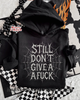 Still don’t give a fuck hoodie by Madness & Mayhem LLC