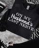 On my husband’s last never embroidered sweatshirt by Madness & Mayhem LLC