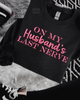 On my husband’s last never embroidered sweatshirt by Madness & Mayhem LLC