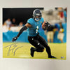 Autographed/Signed Travis Etienne Jr Jacksonville Jaguars 16x20 Football Photo Beckett BAS COA