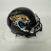 Autographed/Signed Travis Etienne Jacksonville Jaguars Jags Mini Football Helmet Beckett BAS COA