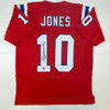 Autographed/Signed Mac Jones New England Red Football Jersey Beckett BAS COA