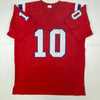 Autographed/Signed Mac Jones New England Red Football Jersey Beckett BAS COA