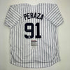 Autographed/Signed Oswald Peraza New York Pinstripe Baseball Jersey JSA COA