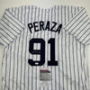 Autographed/Signed Oswald Peraza New York Pinstripe Baseball Jersey JSA COA