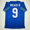 Autographed/Signed Kenneth Walker Seattle Retro Blue Football Jersey Beckett BAS COA