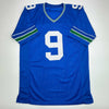 Autographed/Signed Kenneth Walker Seattle Retro Blue Football Jersey Beckett BAS COA