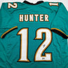 Autographed/Signed Travis Hunter Jacksonville Teal Retro Football Jersey Beckett BAS COA by Hall of Fame Sports Memorabilia