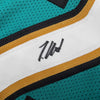 Autographed/Signed Travis Hunter Jacksonville Teal Retro Football Jersey Beckett BAS COA by Hall of Fame Sports Memorabilia