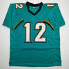 Autographed/Signed Travis Hunter Jacksonville Teal Retro Football Jersey Beckett BAS COA by Hall of Fame Sports Memorabilia