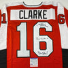 Autographed/Signed Reggie Leach, Bobby Clarke & Bill Barber Philadelphia Orange Hockey Jersey PSA/DNA COA by Hall of Fame Sports Memorabilia