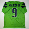 Autographed/Signed Kenneth Walker Seattle Green Football Jersey Beckett BAS COA