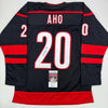 Autographed/Signed Sebastian Aho Carolina Black Hockey Jersey JSA COA by Hall of Fame Sports Memorabilia