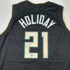 Autographed/Signed Jrue Holiday Milwaukee Black Basketball Jersey Beckett BAS COA