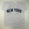 Autographed/Signed Jorge Posada New York Pinstripe Baseball Jersey Beckett BAS COA