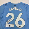 Autographed/Signed Savinho Manchester City Blue Soccer Futbol Jersey Beckett BAS COA by Hall of Fame Sports Memorabilia