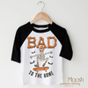 Bad To The Bone Skater Shirt - Halloween Shirt by Madi Moosh