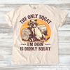 The Only Squat I'm Doing Is Diddley Squat Raccoon Tee - Printed On Comfort Colors by Madi Moosh