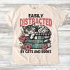 Easily Distracted By Books And Cats Shirt - Printed On Comfort Colors by Madi Moosh