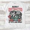 Easily Distracted By Books And Cats Shirt - Printed On Comfort Colors by Madi Moosh