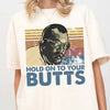 Retro “Hold On To Your Butts” T-Shirt – Funny Dinosaur-Inspired Graphic Tee, Unisex 90s Movie Quote Shirt by Dog Mom Hat