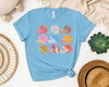 Football Helmets Graphic Tee by Anchored Grace Boutique