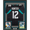 Framed Autographed/Signed Travis Hunter 35x39 Jacksonville Black Football Jersey Beckett BAS COA by Hall of Fame Sports Memorabilia